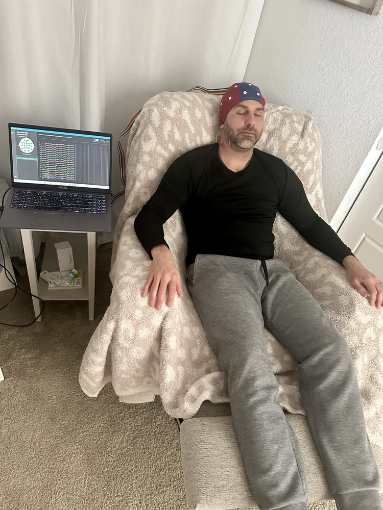 Individual receiving neurofeedback therapy session for PTSD and trauma recovery in Colorado