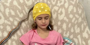 Child undergoing neurofeedback therapy to manage depression in kids