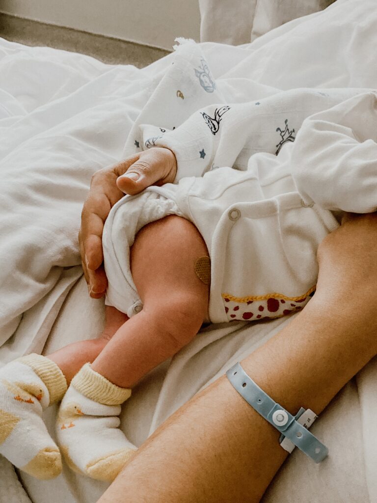 Natural approaches to traumatic birth history symbolized by a mother holding her newborn, representing healing and recovery after childbirth.